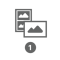 Two picture frames with mountain landscapes and the number one.