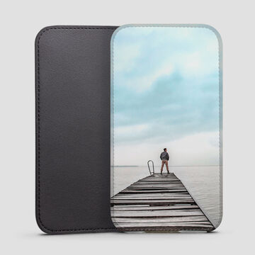 faux leather phone sleeve with image of guy on dock printed onto it
