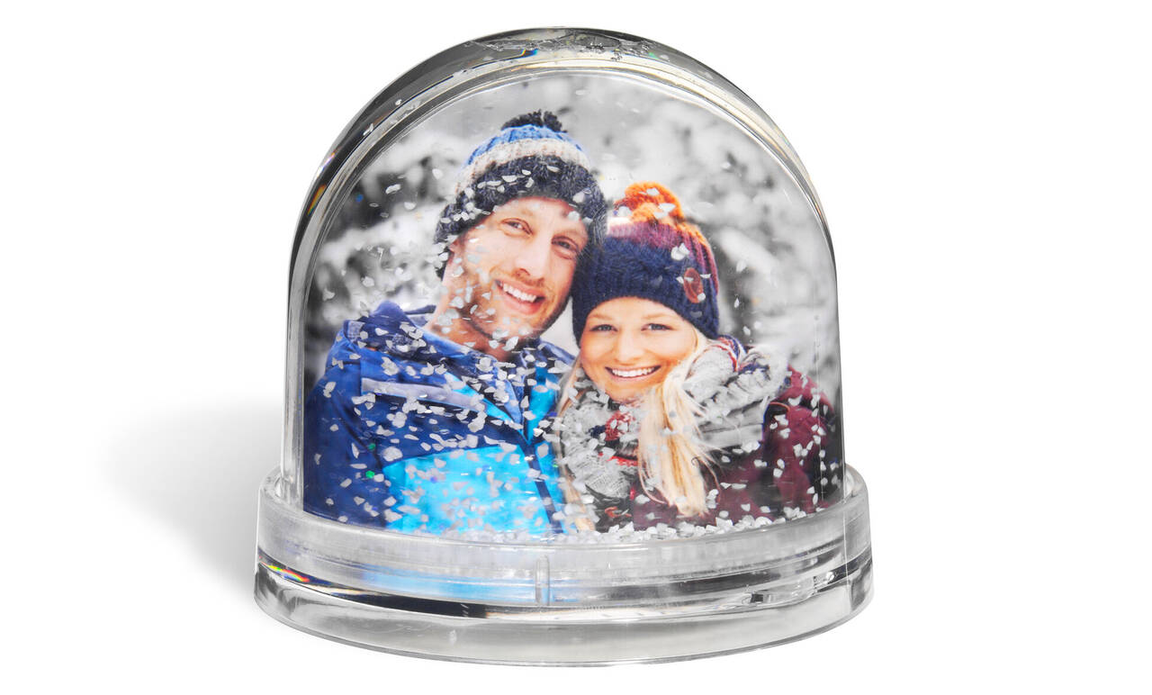 personalised snow globe with image of couple inside.