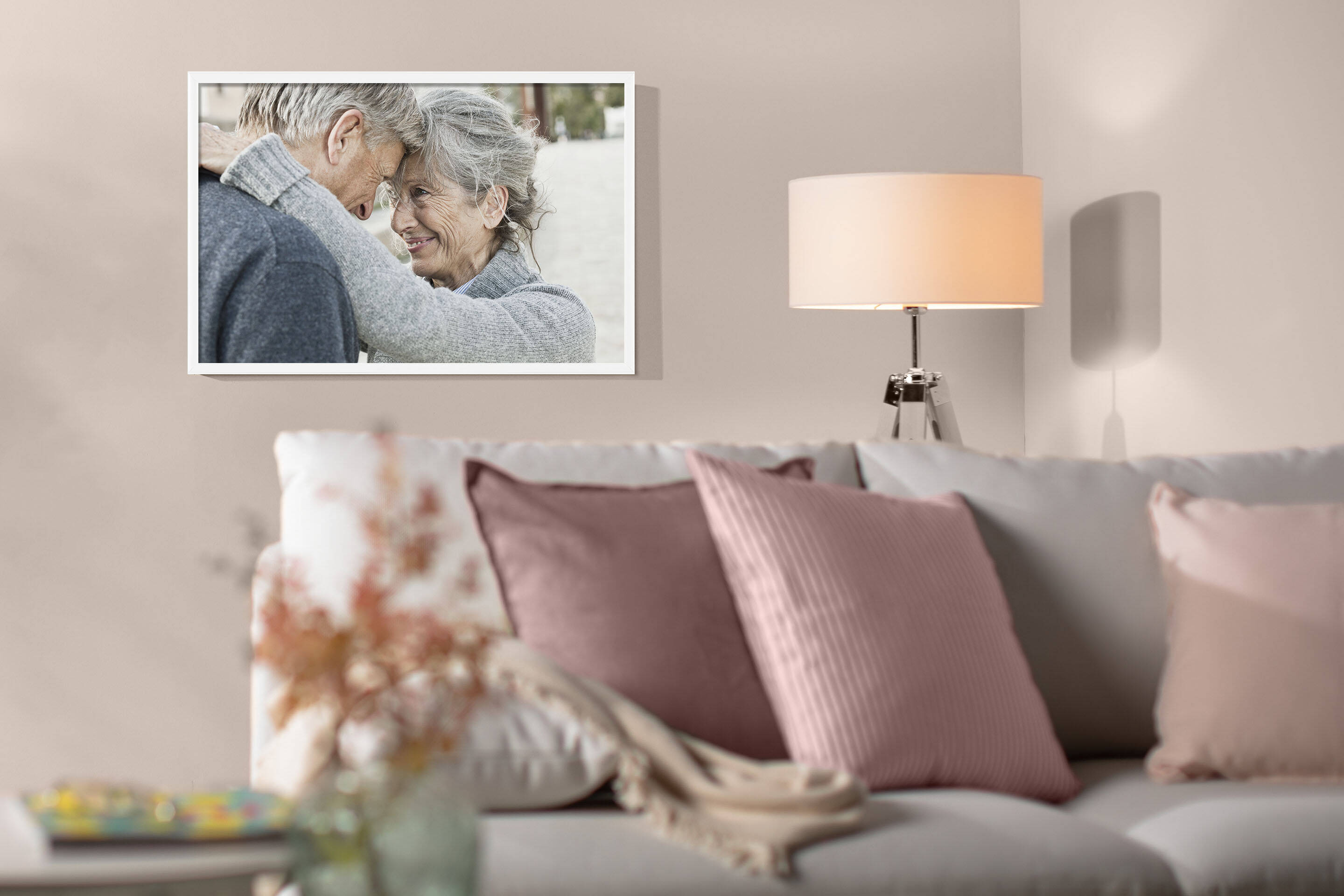 Photo of elderly couple framed in white wood frame